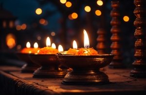 A lit candle on the ground with colorful decor, diwali stock images, realistic stock photos