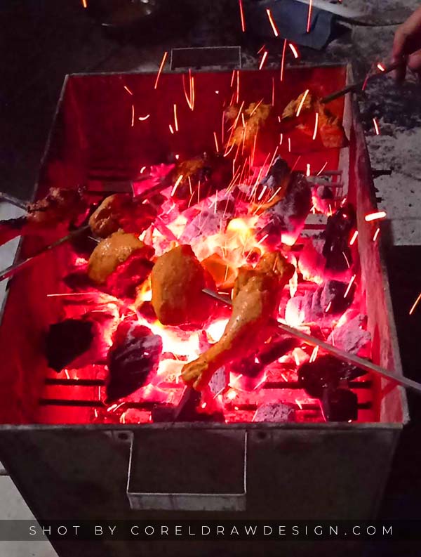 Chicken Leg Pieces Roasting on Barbecue Fire