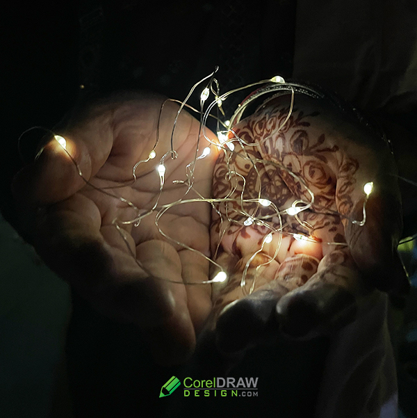 Woman Hands Holding String Of Lights In The Dark Stock Photo - Free Download from CorelDrawDesign