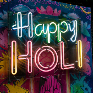 happy Holi lettering neon light sign stock image
